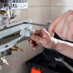 Close-up of a gas water heater reparation